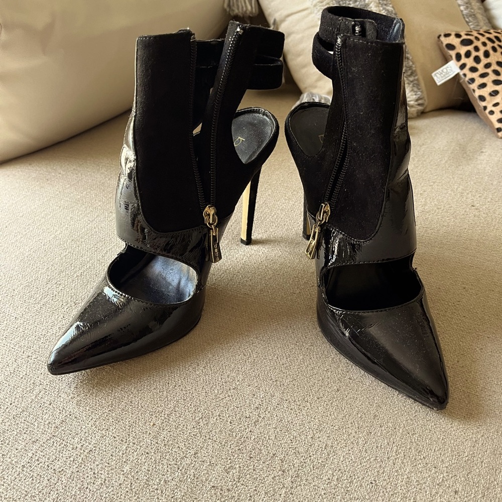 BEBE black closed toe heel pumps with gold zipper